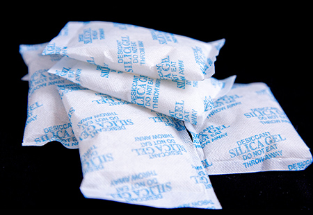 What is a desiccant and what is its moisture absorption principle?