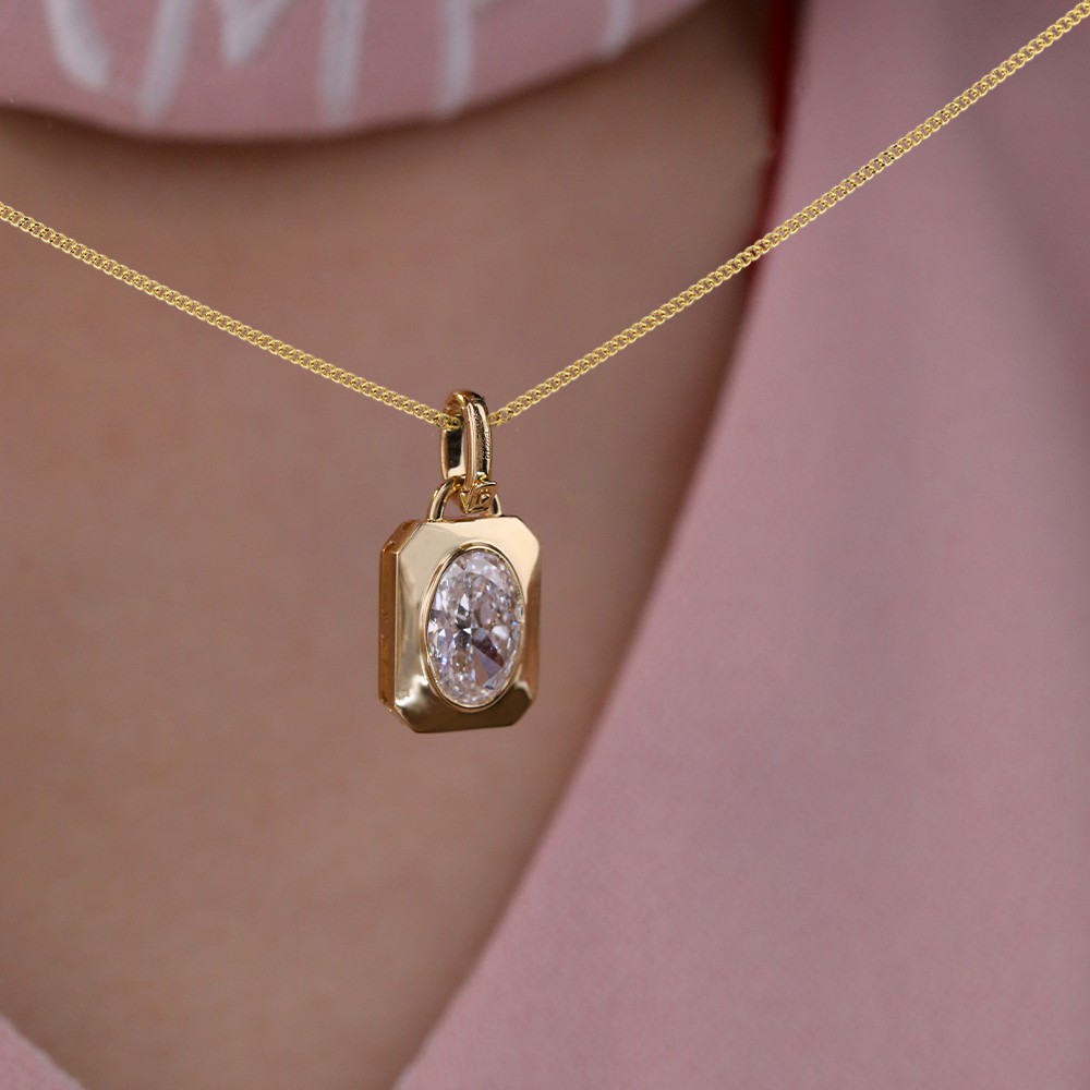 1.1ct oval diamond bezel-set 18K gold pendant