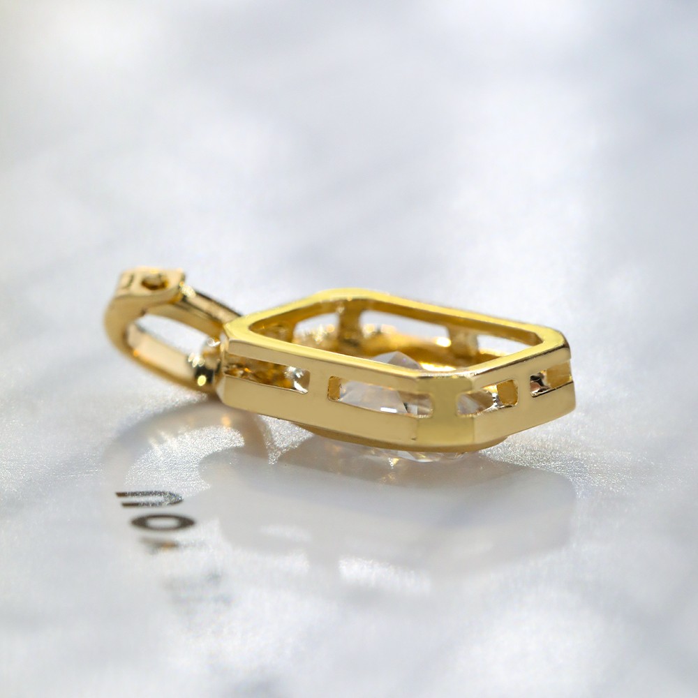 1.1ct oval diamond bezel-set 18K gold pendant