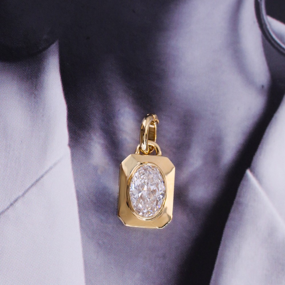1.1ct oval diamond bezel-set 18K gold pendant