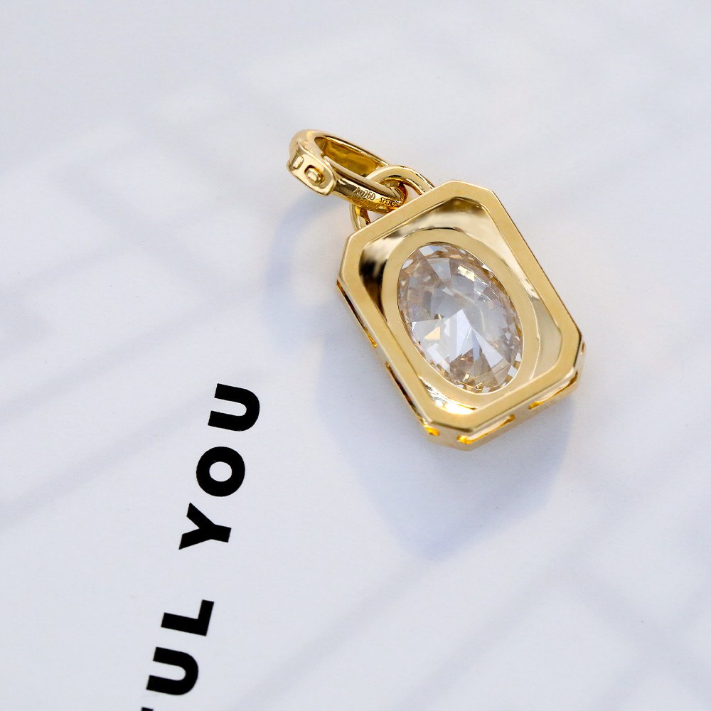 1.1ct oval diamond bezel-set 18K gold pendant