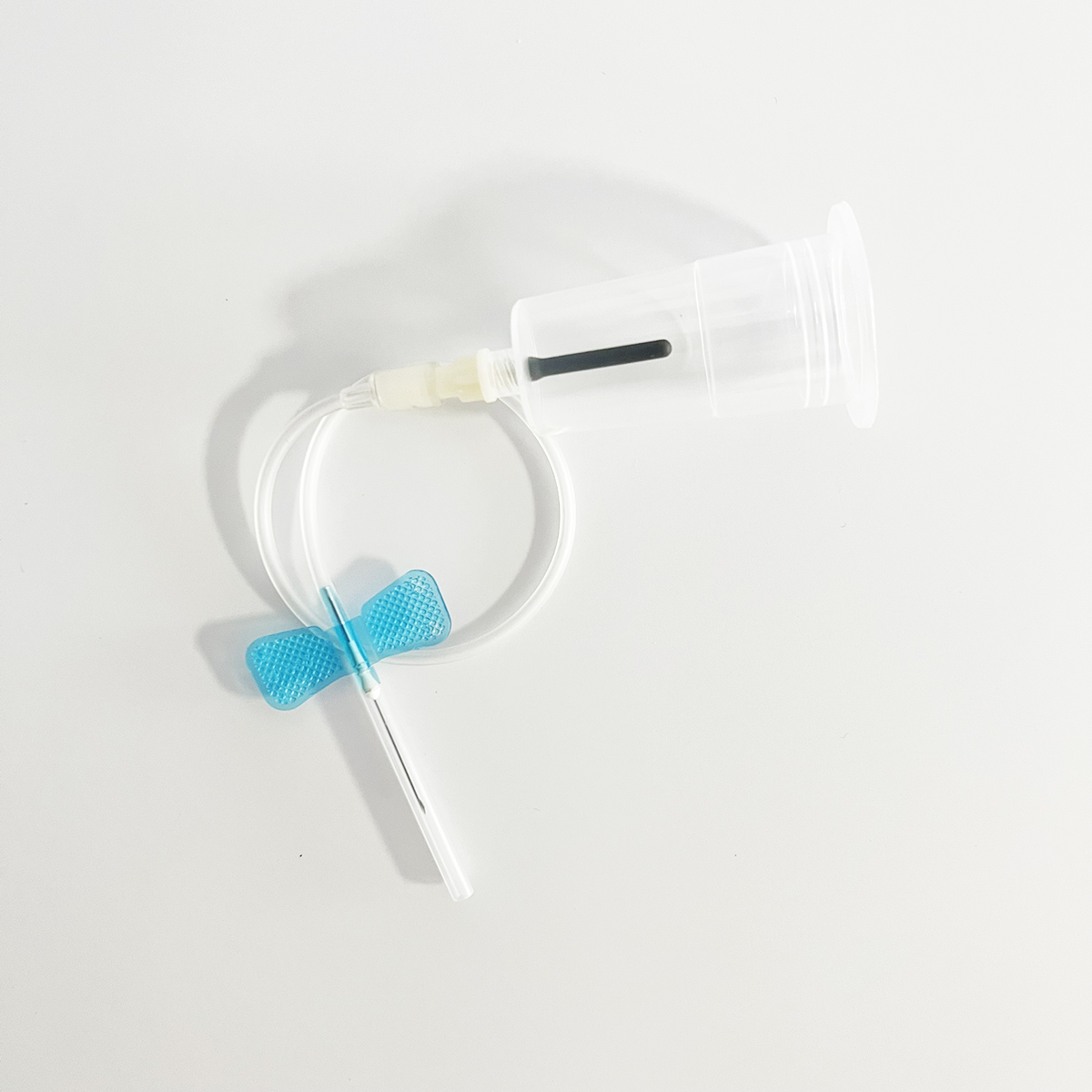 butterfly type blood collection needle with preattached holder