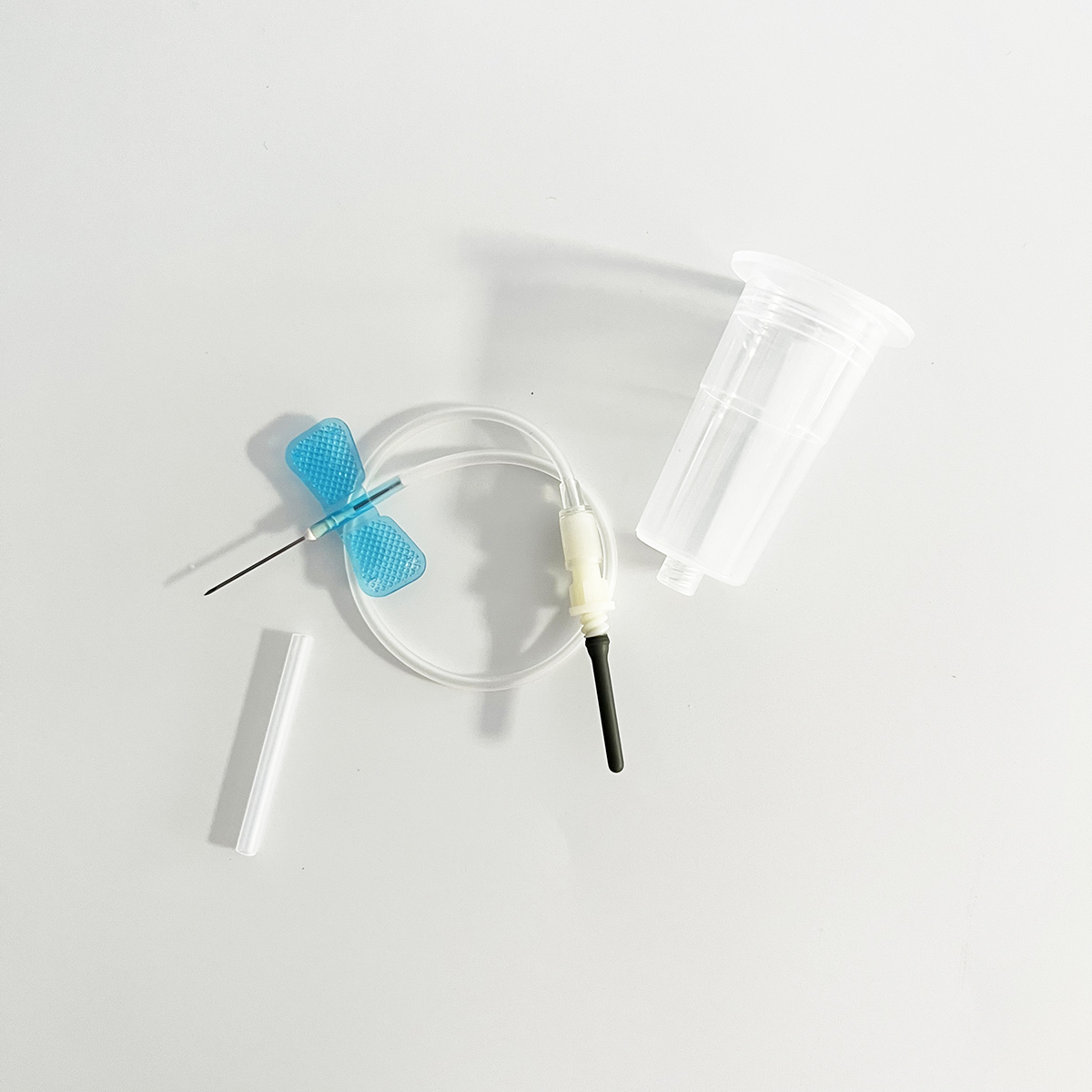 butterfly type blood collection needle with preattached holder