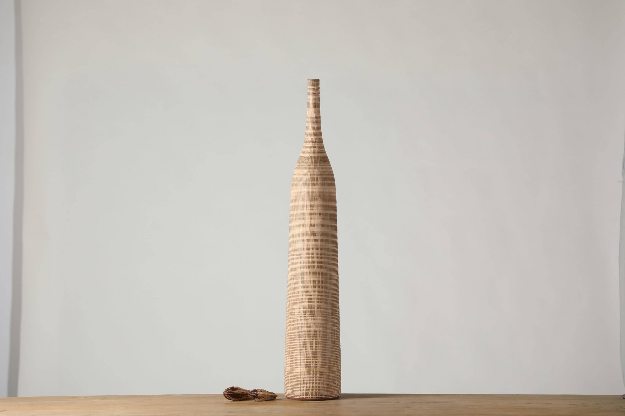 Another fine-grained long-neck African rattan style resin craft vase