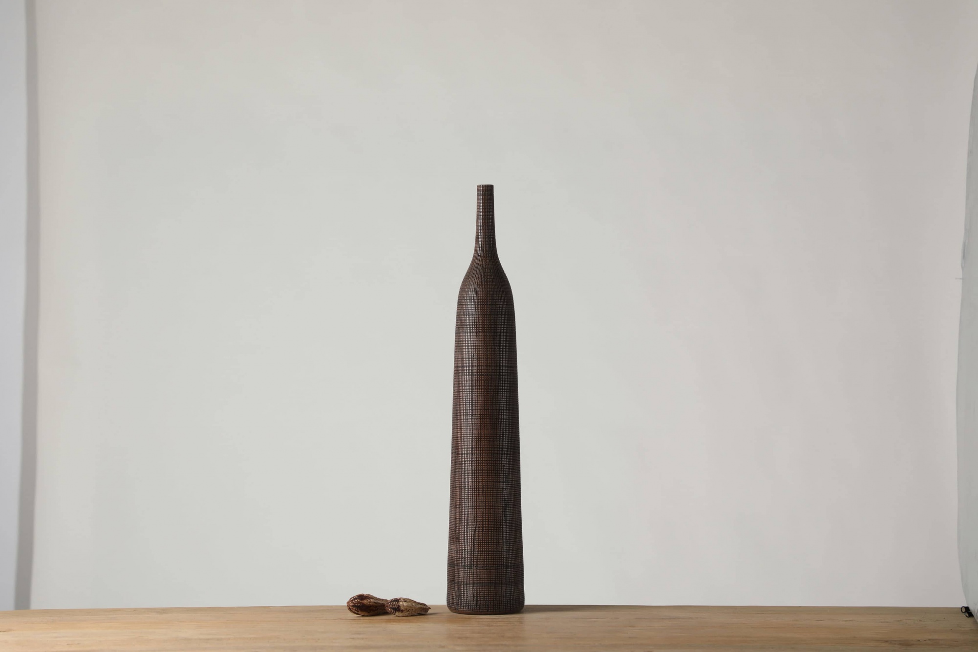 Another fine-grained long-neck African rattan style resin craft vase