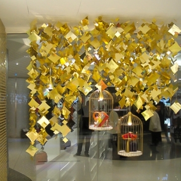 Low cost gold sequin string arrangement background window display design inspiration recommendation