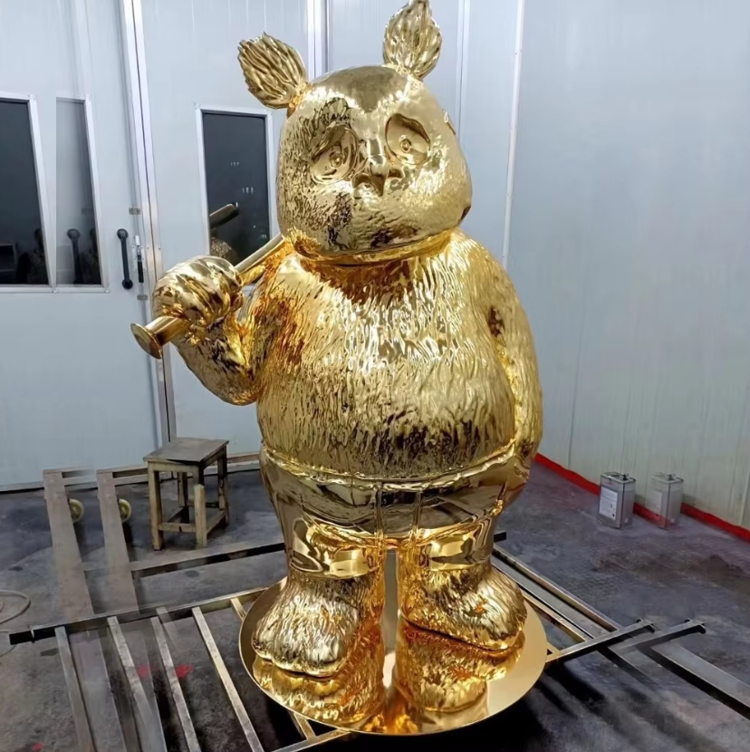 Full body golden electroplated black bear statue