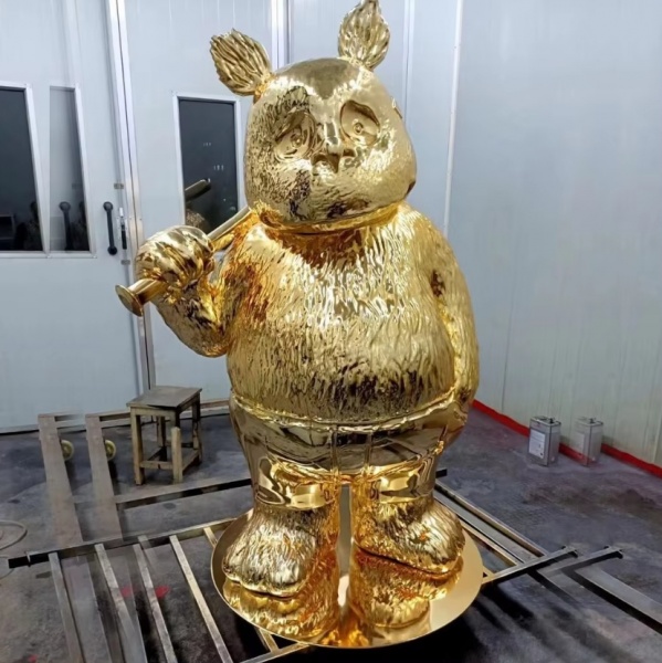 Full body golden electroplated black bear statue