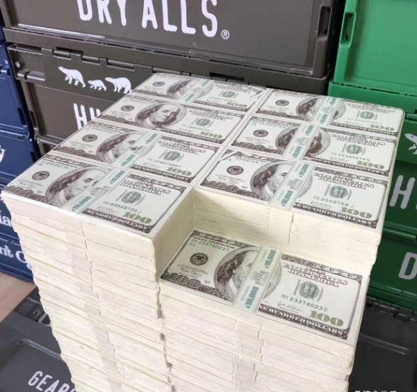 Counterfeit currency props placed, stacked, and displayed as props