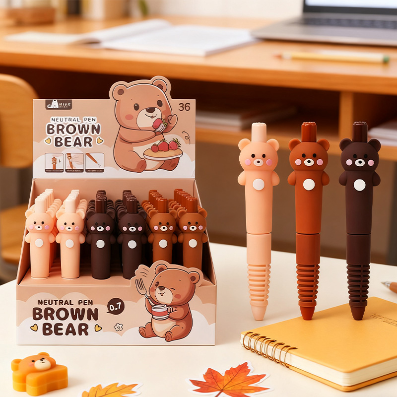 The three-color teddy bear presses the pen
