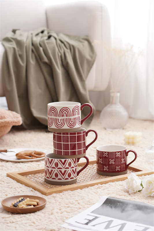 A coarse earthenware red striped cup