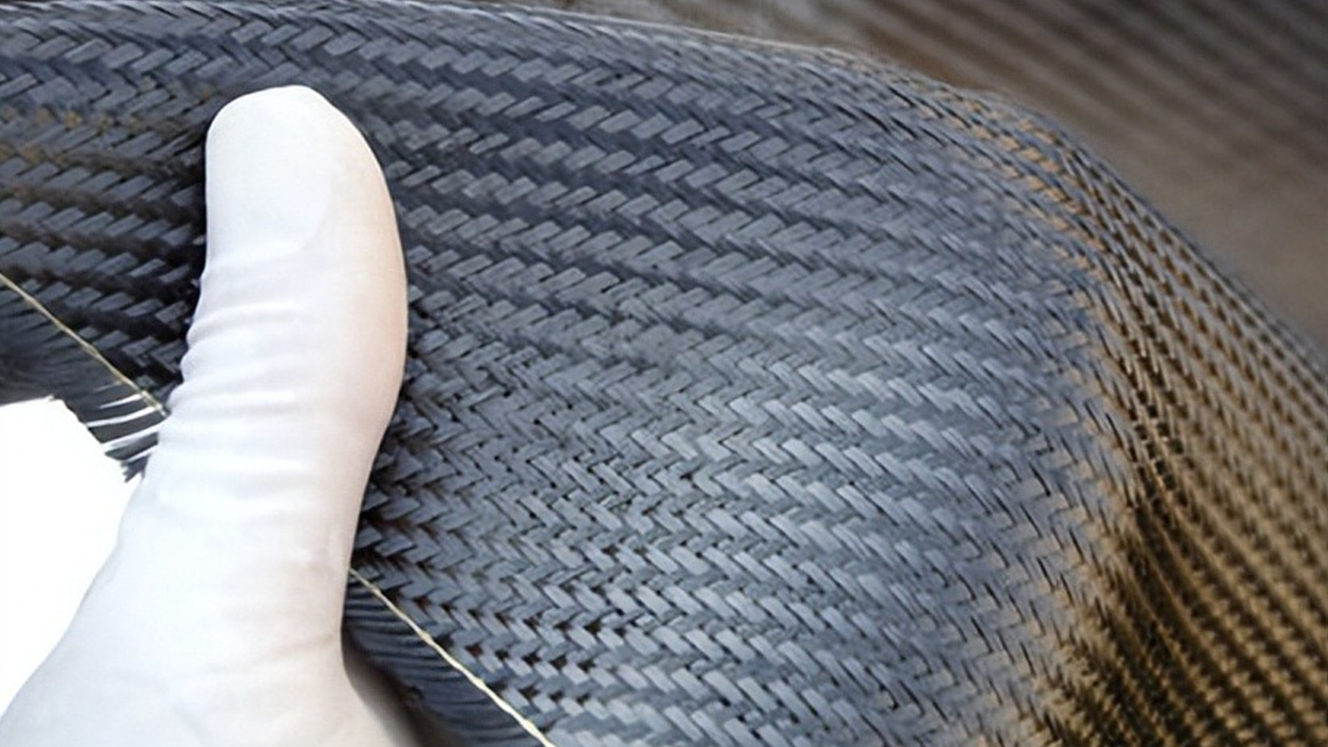 Is carbon fiber a composite material? What is its relationship with composite materials?