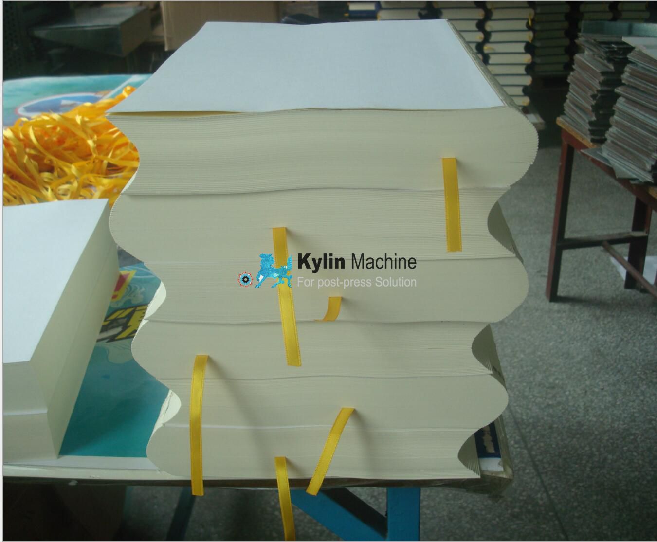 Book spine rounding and backing machine