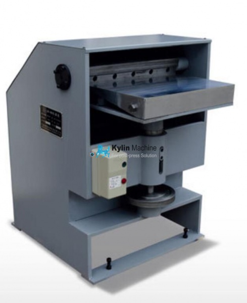Book spine rounding and backing machine