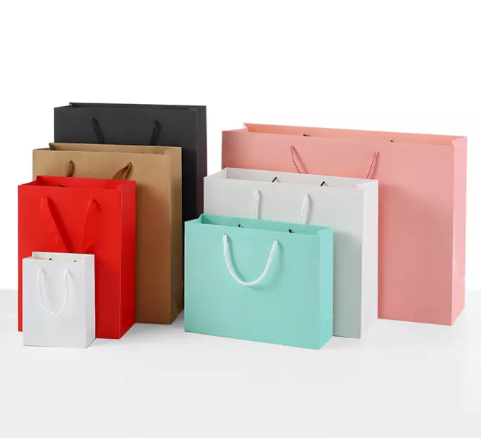 OEM wholesale custom printed luxury shopping gift packaging clothing paper bag with your own logo for boutique