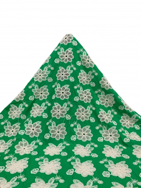 Green pure cotton fabric with daisy embroidery.