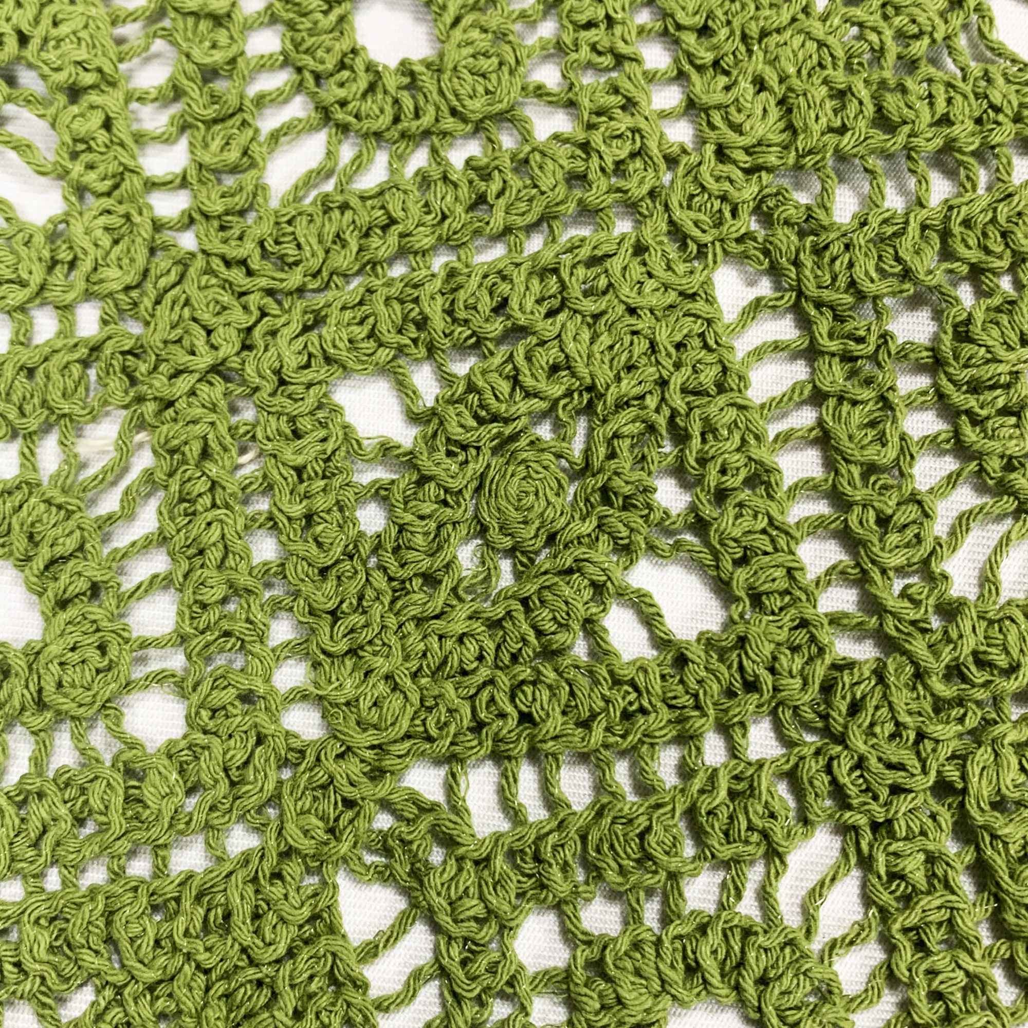 Light green machine-crocheted knitted embroidered fabric