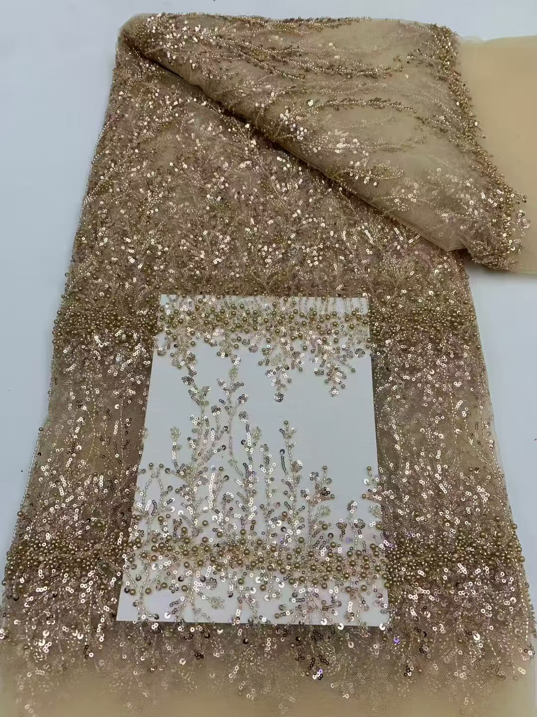 Sequined and embroidered fabrics -- used for sweet lace dresses, wedding gowns, and evening gowns.