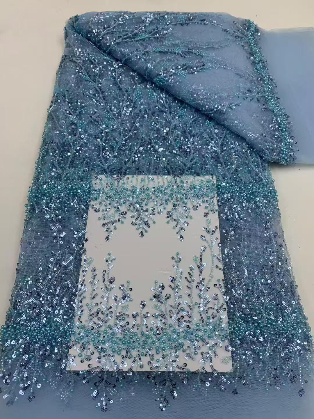 Sequined and embroidered fabrics -- used for sweet lace dresses, wedding gowns, and evening gowns.