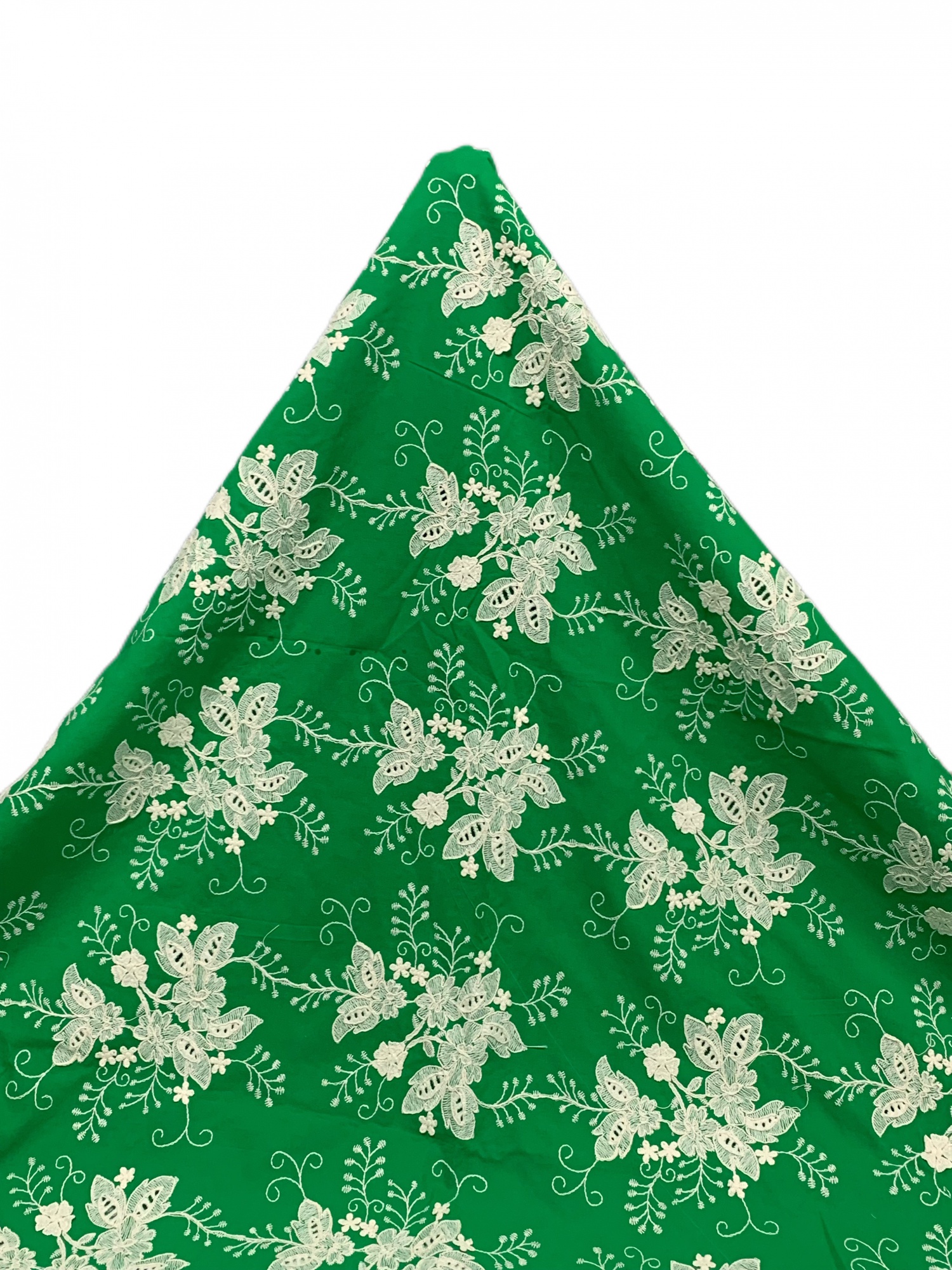 Green cotton fabric with floral embroidery and ribbon details. Used for clothing, home textiles, decorations, skirts, and headwear.